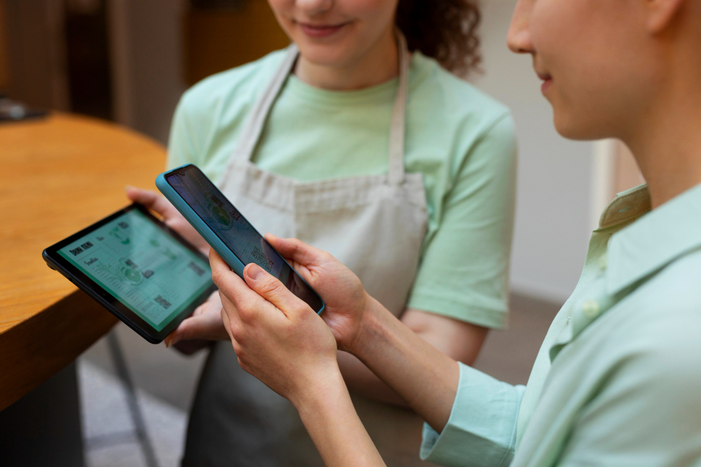 Team members coordinating orders on mobile devices.